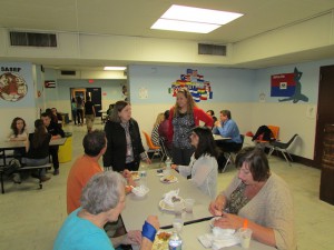 Mrs. Paternostro, Ms. Romero, Mrs. Modrak, and others enjoy an evening of food and conversation